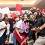 Total Kenya Staff posing infront of a photobooth